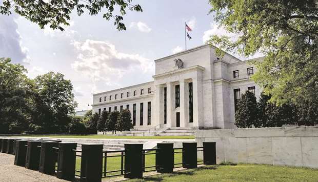 The Federal Reserve building in Washington, DC. The pandemic recovery is in a new phase as multiple central banks start or plot the withdrawal of emergency stimulus, gradually shifting from peak support and opening up divergences in international policymaking.