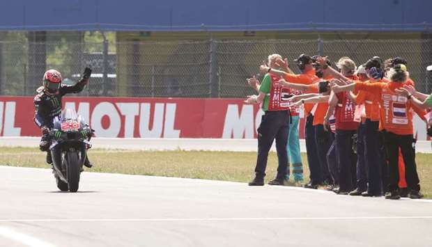 Monster Energy Yamahau2019s Fabio Quartararo (also top) celebrates winning the Dutch Grand Prix MotoGP race at TT Assen circuit in Assen, Netherlands, yesterday. (Reuters)
