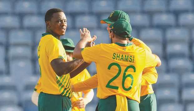 Kagiso Rabada (left) of South Africa celebrates the dismissal of Andre Fletcher of the West Indies during their second T20I match at the Grenada National Cricket Stadium in Saint Georgeu2019s, Grenada, on Sunday. (AFP)