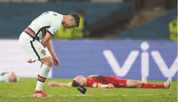 Portugalu2019s captain Cristiano Ronaldo reacts after losing to Belgium in the Euro 2020 Round of 16 match in Seville, Spain, on Sunday night. (Reuters)