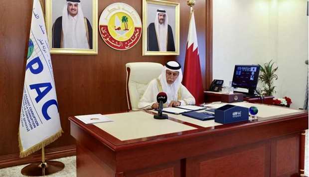 HE the Speaker of the Shura Council and Chairperson of the Organization Ahmed bin Abdullah bin Zaid Al Mahmoud signs the MoU