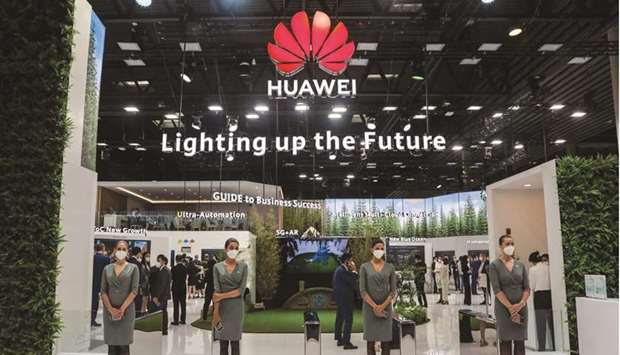 Workers wait for attendees by the entrance to the private Huawei Technologies Co pavilion on the opening day of the MWC Barcelona at the Fira de Barcelona venue in Barcelona yesterday. During an address to the gathering yesterday, the president of Huaweiu2019s business carrier business, Ryan Ding, highlighted innovations of its 5G network equipment which make it easy to install and reduce energy consumption.