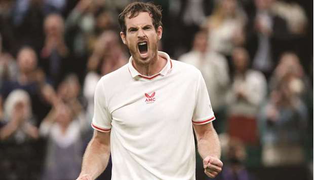 Britainu2019s Andy Murray celebrates winning his Wimbledon first round match against Georgiau2019s Nikoloz Basilashvili. (Reuters)