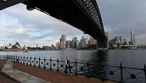 (File photo) A woman walks under the Harbour Bridge in Sydney, recently.