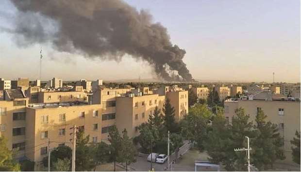 Smoke rises at an oil refinery in Tehran, yesterday.