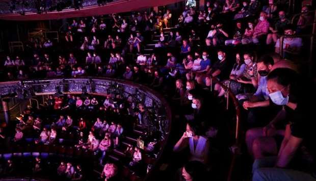 Guests watch a performance of the West End show 'The Show Must Go On' at the Palace Theatre, amid the spread of coronavirus disease in London, Britain, June 2. REUTERS
