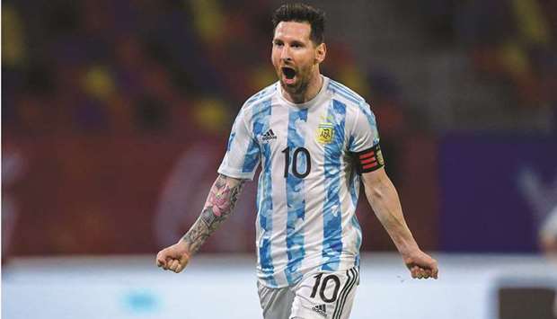 Argentinau2019s Lionel Messi celebrates after scoring against Chile during their South American qualification football match for the FIFA World Cup Qatar 2022 in Santiago del Estero, Argentina. (AFP)