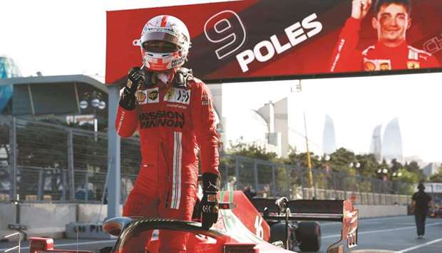 Ferrariu2019s Charles Leclerc celebrates after qualifying in pole position for the Azerbaijan Grand Prix in Baku yesterday. (Reuters)