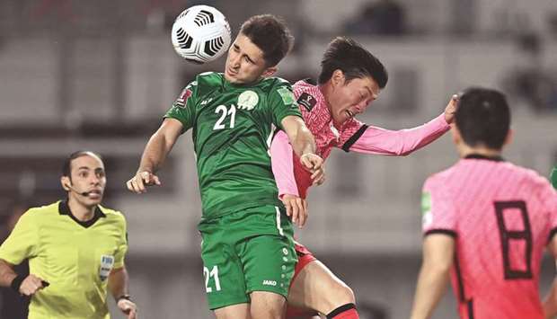 South Koreau2019s Hwang Ui-jo (right) and Turkmenistanu2019s Halmammedov Rovshengeldi jump for the ball during their Asian qualifiers for the FIFA World Cup Qatar 2022. (AFP)