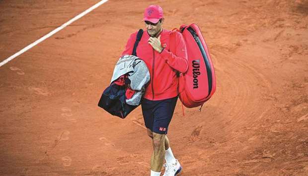 Switzerlandu2019s Roger Federer leaves the court after winning against Germanyu2019s Dominik Koepfer in Paris on Saturday.