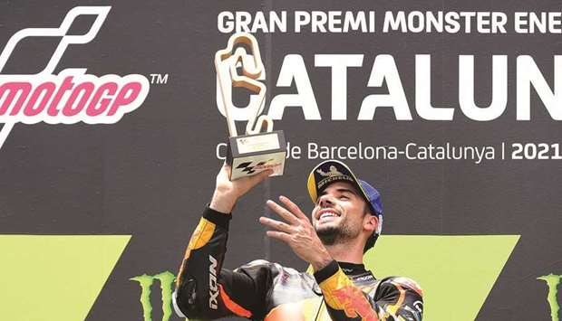 KTM Portuguese rider Miguel Oliveira celebrates on the podium after winning the MotoGP race of the Moto Grand Prix de Catalunya at the Circuit de Catalunya yesterday.