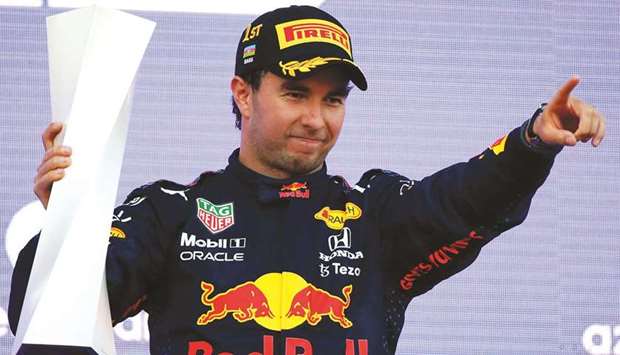 Red Bullu2019s Mexican driver Sergio Perez celebrates on the podium after winning the Formula One Azerbaijan Grand Prix at the Baku City Circuit in Baku yesterday.