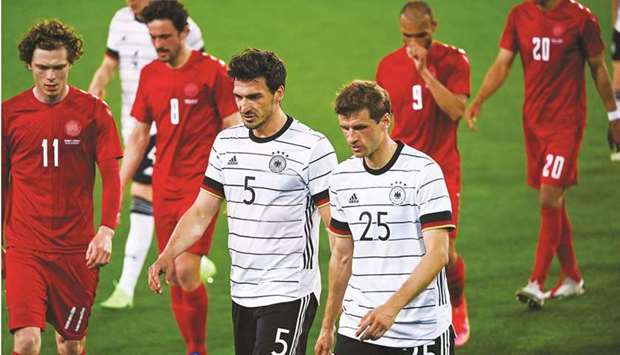 Germanyu2019s Mats Hummels (left) and Thomas Mueller walk off the pitch for half-time during the friendly against Denmark in Innsbruck, Austria, on Wednesday. (AFP)