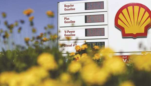 Gas prices are shown at a Shell gas station in Encinitas, California (file). With companies such as Apple, Royal Dutch Shell and Unilever all committing to reach net-zero emissions, the carbon contribution of global supply chains is under scrutiny like never before.