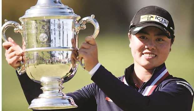 Yuka Saso hoists the US Open trophy after winning in a sudden death playoff over Nasa Hataoka following the final round of the US Womenu2019s Open golf tournament at The Olympic Club. (USA TODAY Sports)