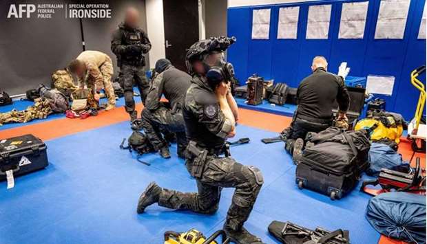 Australian Federal Police are seen during its Operation Ironside against organised crime. Australian Federal Police/Handout via REUTERS