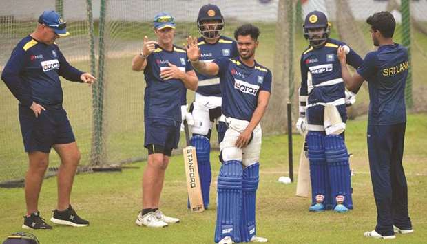 Sri Lankau2019s coach Mickey Arthur (left), Kusal Mendis (third from left) batting coach Grant Flower (second from left), Dhananjaya de Silva (third from right) during a training session in Sher-e-Bangla National Cricket Stadium in Dhaka on May 26, 2021. (AFP)