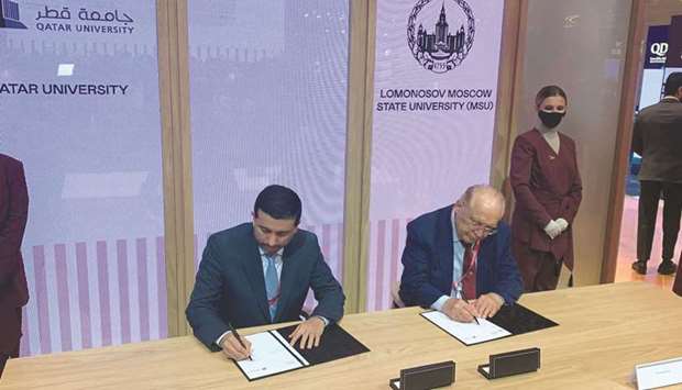 QU president Dr Hassan al-Derham signing a MoU at SPIEF 2021 in Russia.