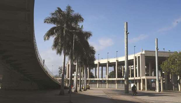 People walk in front of the Maracana stadium in Rio de Janeiro yesterday. (Reuters)
