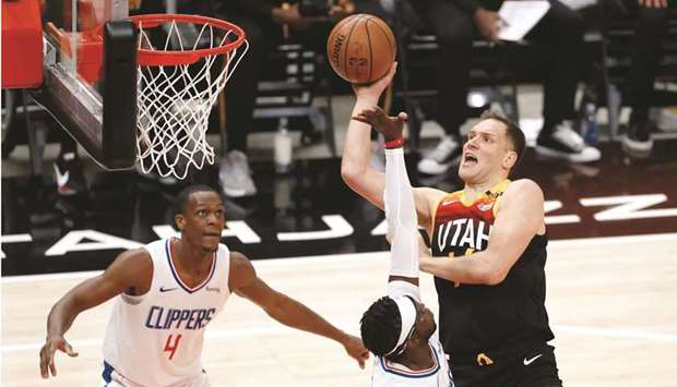 Utah Jazz forward Bojan Bogdanovic shoots over LA Clippers guard Reggie Jackson in the second quarter during game one in the second round of the 2021 NBA Playoffs at Vivint Arena. (USA TODAY Sports)