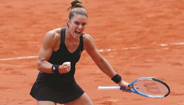 Greeceu2019s Maria Sakkari celebrates her win over Polandu2019s Iga Swiatek (not pictured) during their French Open quarter-final at Roland Garros in Paris, France, yesterday. (Reuters)