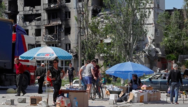 Street vendors sell goods during Ukraine-Russia conflict in the southern port city of Mariupol, Ukraine.