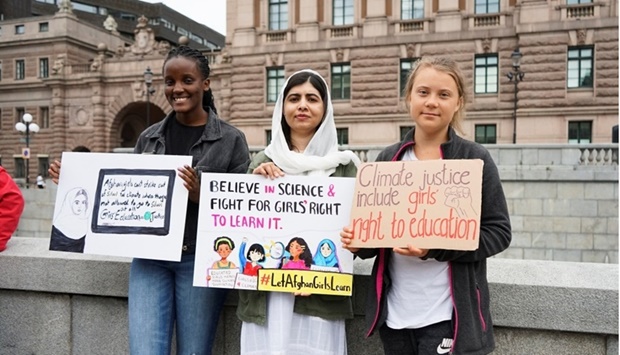 Ugandan climate activist Vanessa Nakate, Nobel peace prize winner Malala Yousafzai and Swedish activist Greta Thunberg protest outside the Swedish parliament, during a ,Fridays For Future, protest, in Stockholm, Sweden. REUTERS