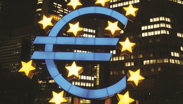 SPOTLIGHT: The euro in front of the European Central Bank in Frankfurt. Now that the ECB has indicated that it will stop net bond purchases, the question is whether markets will feel confident that, provided debts remain sustainable, interest-rate spreads will be contained.