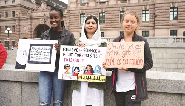 Ugandan climate activist Vanessa Nakate, Nobel peace prize winner Malala Yousafzai, and Swedish activist Greta Thunberg protest outside the Swedish parliament, during a u2018Fridays For Futureu2019 protest, in Stockholm.