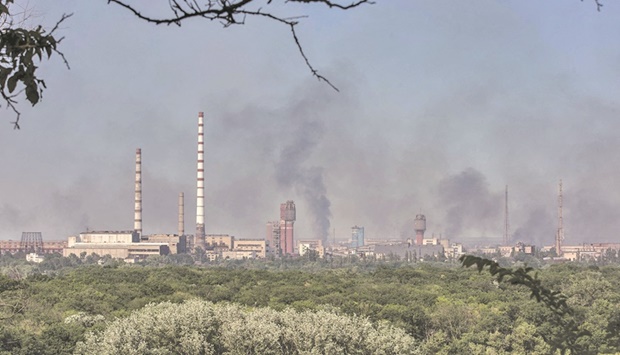 Smoke rises after a military strike on a compound of Sievierodonetsku2019s Azot Chemical Plant in Lysychansk town of Ukraineu2019s Luhansk region yesterday. (Reuters)