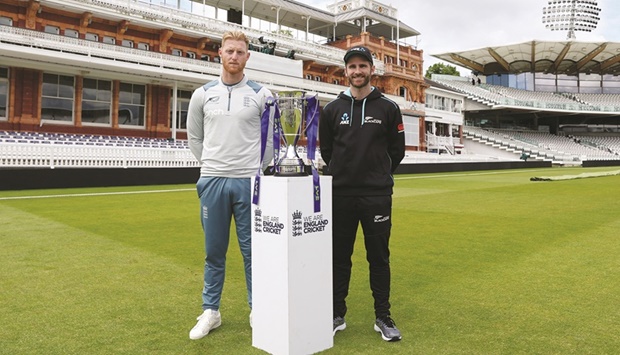 Englandu2019s Ben Stokes poses with New Zealandu2019s Kane Williamson and the series trophy at the Lordu2019s Cricket Ground in London yesterday. (Reuters)