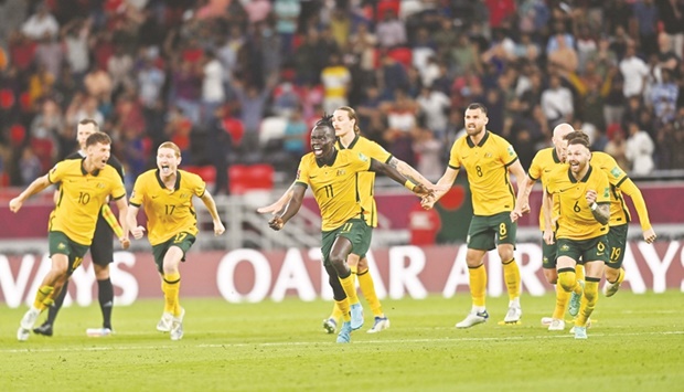 Australiau2019s players celebrate winning the FIFA World Cup 2022 inter-confederation play-offs match against Peru at the Ahmad Bin Ali Stadium in Umm Al Afaei. PICTURES: Noushad Thekkayil