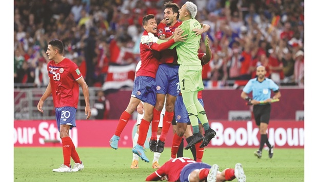Costa Ricau2019s players celebrate their win in the FIFA World Cup Qatar 2022 intercontinental playoff against New Zealand at Ahmad Bin Ali Stadium.