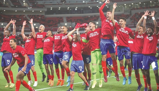 Costa Ricau2019s players celebrate after their win in the FIFA World Cup 2022 inter-confederation play-off match against New Zealand at the Ahmad Bin Ali Stadium in Al Rayyan on Tuesday night. Costa Rica won 1-0 to claim the last spot at this yearu2019s World Cup. (AFP)