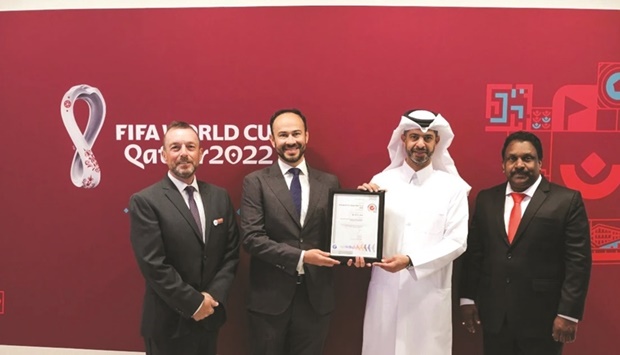 Nasser al-Khater and other officials with the ISO 20121 certification.