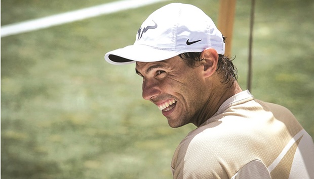 Spainu2019s Rafael Nadal smiles during a training session at Santa Ponsa Country Club, on the Spanish Balearic Island of Mallorca, yesterday. (AFP)
