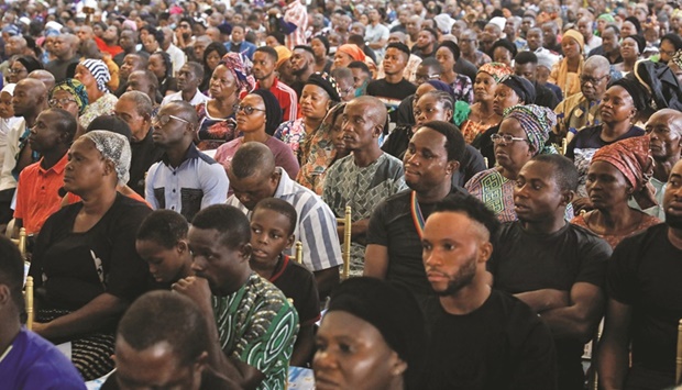 People attend a mass memorial service for victims killed in an attack by gunmen during a Sunday mass service, at St Francis Catholic Church in Owo, Ondo, Nigeria, yesterday.