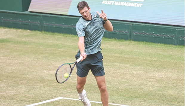 Polandu2019s Hubert Hurkacz returns the ball to Australiau2019s Nick Kyrgios in the semi-finals of the ATP 500 Halle Open in Halle, western Germany, yesterday. Hurkacz won 4-6, 7-6, 7-6. (AFP)