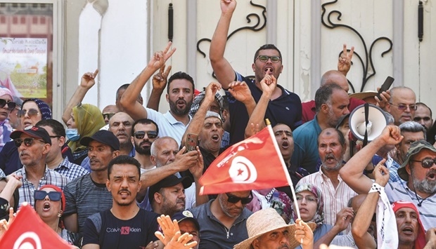 Tunisian protesters chant slogans against President Kais Saied and the upcoming constitutional referendum to be held on July 25, at a rally in the capital Tunis, yesterday.