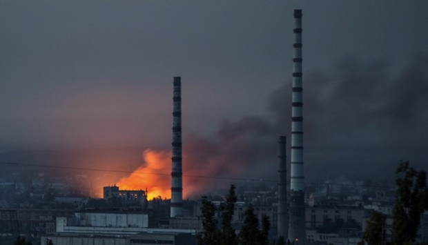 Smoke and flame rise after a military strike on a compound of Sievierodonetsk's Azot Chemical Plant, as Russia's attack on Ukraine continues, in Lysychansk, Luhansk region, Ukraine. REUTERS