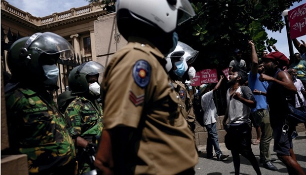 Demonstrators shout slogans demanding the immediate release from police custody of the demonstrators who were obstructing an entrance to Sri Lanka's Presidential Secretariat, amid the country's economic crisis, in Colombo. REUTERS