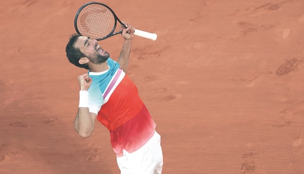 Croatiau2019s Marin Cilic celebrates after victory over Russiau2019s Andrey Rublev in their French Open quarter-final in Paris yesterday. (AFP)