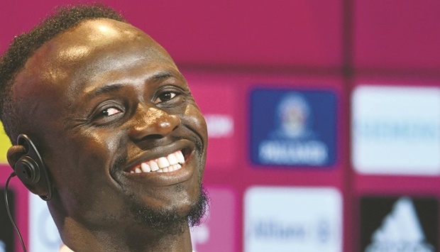 Bayern Munichu2019s new signing Sadio Mane smiles during a press conference after he signed a three-year deal with the Bundeliga champions yesterday. (AFP)
