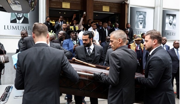 The coffin of Democratic Republic of Congo's first prime minister and independence hero Patrice Lumumba is carried away after a tribute ceremony at The Congolese Embassy before the departure of his last remains to DR Congo in Brussels on Tuesday.