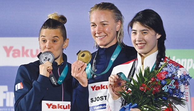 Silver medallist Franceu2019s Mu00e9lanie Henique (left), gold  medallist Swedenu2019s Sarah Sjostrom (centre) and bronze medallist Chinau2019s Zhang Yufei pose with their medals following the womenu2019s 50m butterfly finals. (Reuters)