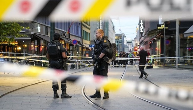 Norwegian police officers stand guard in the streets of central Oslo, Norway, on June 25, 2022.