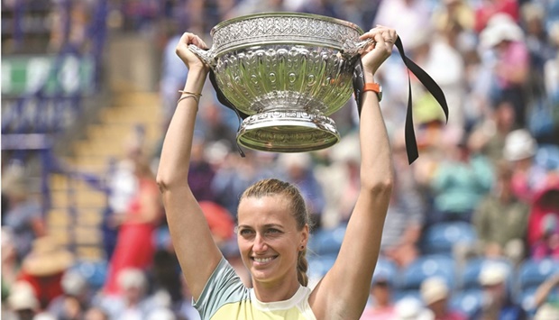 Czech Republicu2019s Petra Kvitova celebrates with the trophy after defeating Latviau2019s Jelena Ostapenko in the Eastbourne International final yesterday. (AFP)