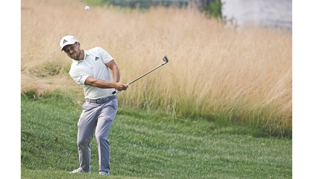 Xander Schauffele of the US chips on the 16th green during the second round of Travelers Championship at TPC River Highlands in Cromwell, Connecticut.  (AFP)