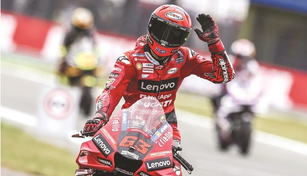 Ducati Lenovo Team Italian rider Francesco Bagnaia reacts after setting the fastest time during MotoGP qualifying at the TT circuit of Assen yesterday. (AFP)