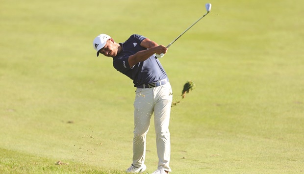 Xander Schauffele of the US plays a shot on the 18th hole during the third round of Travelers Championship at TPC River Highlands in Cromwell, Connecticut. (AFP)